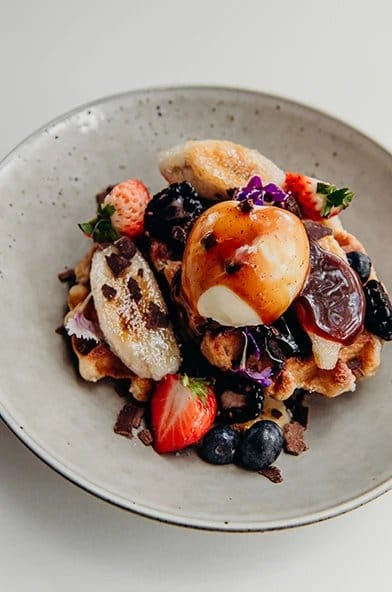 Waffle plate with banana, berries and gelato served at Ronnie's, Pokolbin