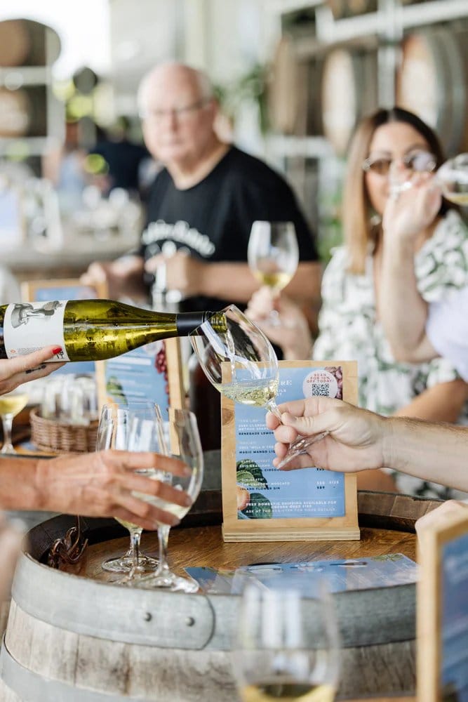 Wine being poured and tasted at wine bar