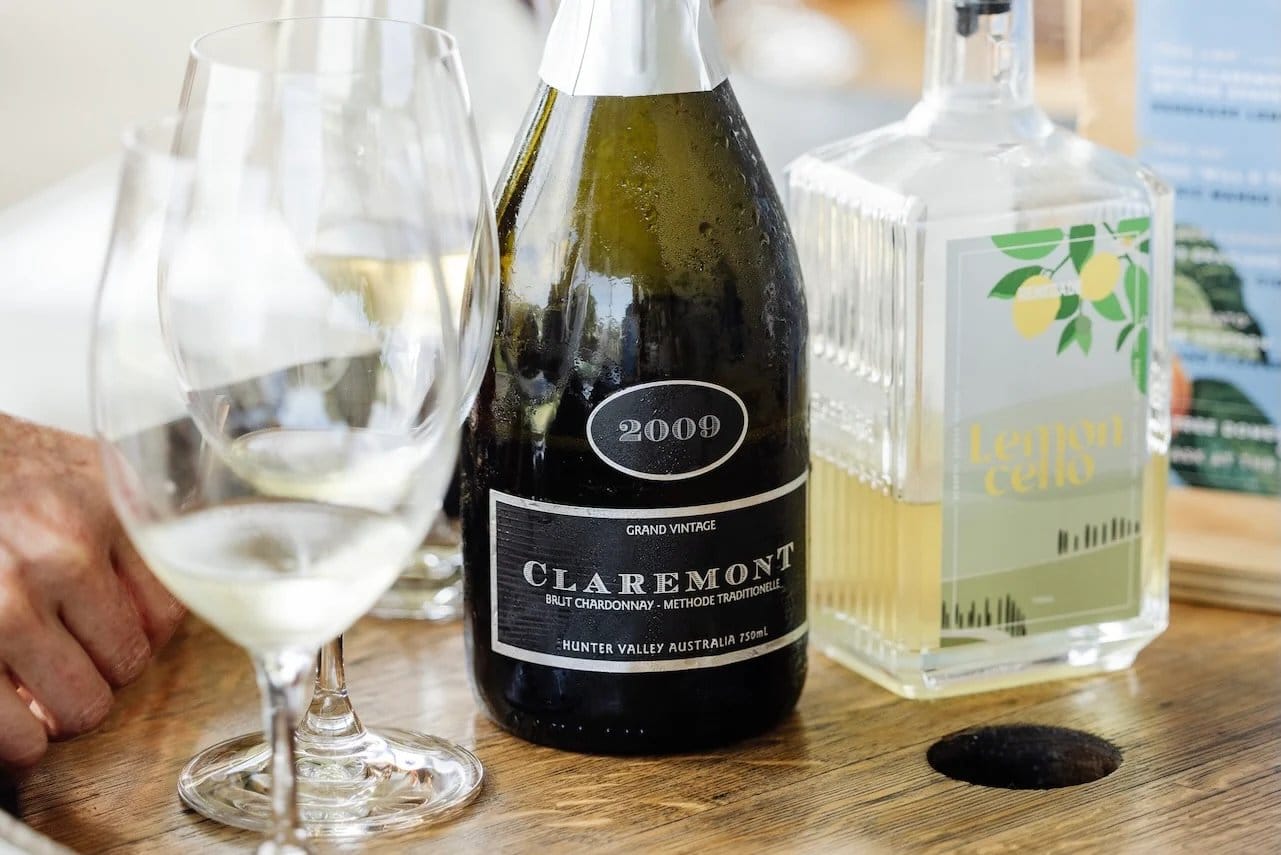Claremont brut wine bottle and tasting glass