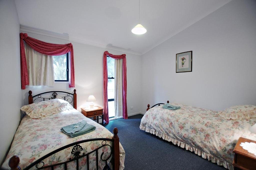 Twin room with two single beds and a private door onto the verandah.