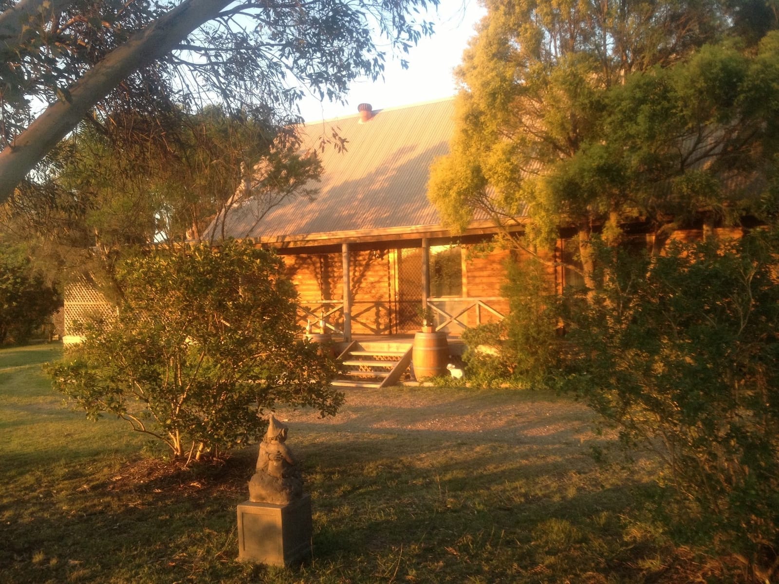 Log cabin exterior at golden hour at Silverpoint Estate, Pokolbin, Hunter Valley