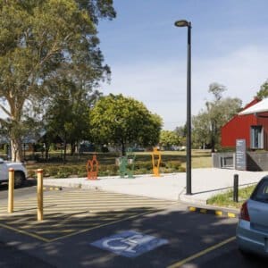 The accessible car park and grounds outside the centre, with public art sculptures beside the path