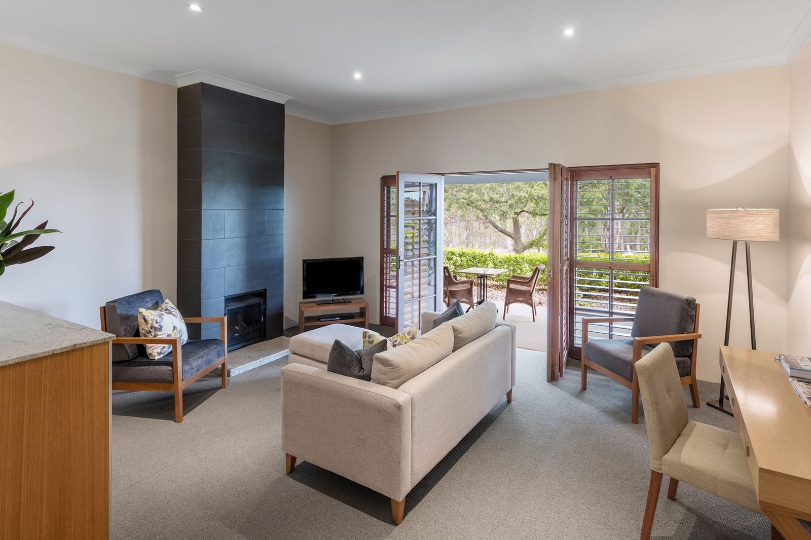 Guest bedroom with sitting area and garden access
