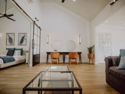 Suite living area with vaulted ceiling and timber flooring at Squires Vineyard, Belford, Hunter Valley