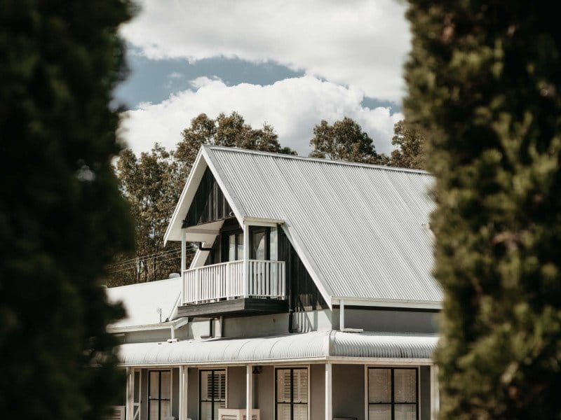Guest house exterior with peaked roof and balcony at Squires Vineyard, Belford, Hunter Valley