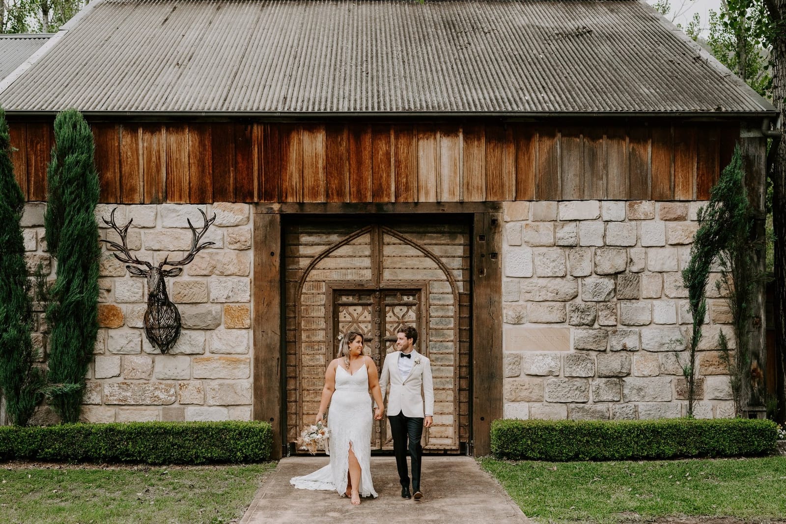 Stone winery building with weathered wood and entrance