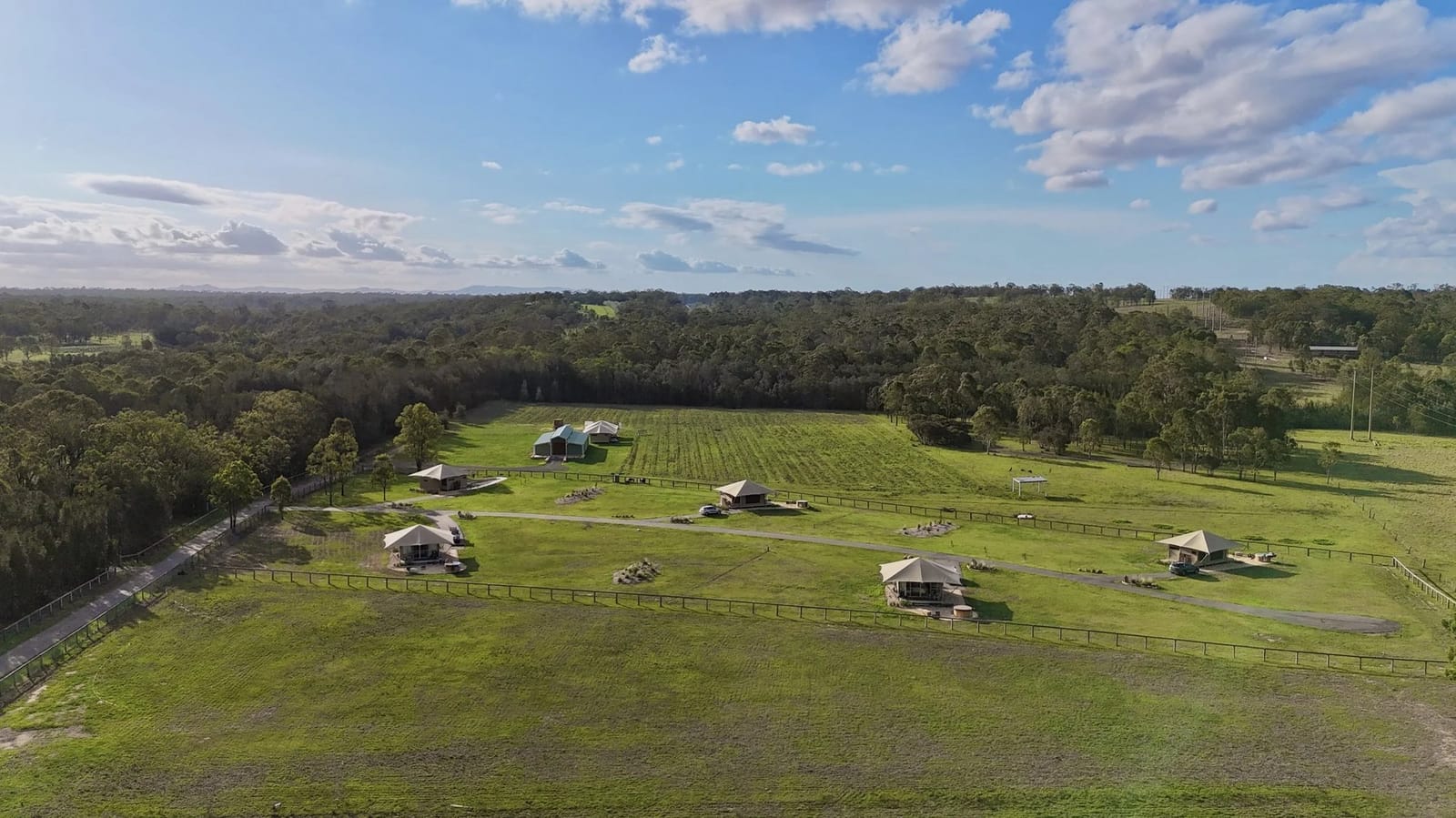 Aerial view of glamping tents scattered across property at The Beltree Wine Country Glamping, Belford, Hunter Valley