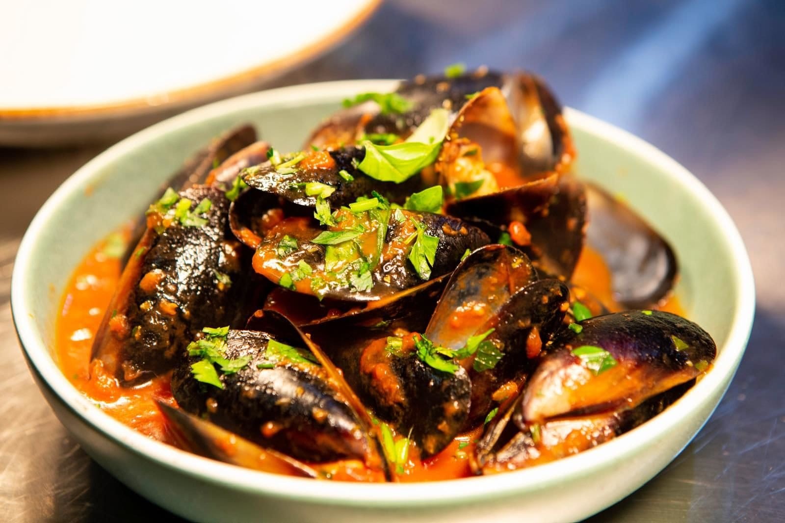 Mussels with fresh herbs and tomato sauce at The Italian Cottage, Pokolbin, Hunter Valley