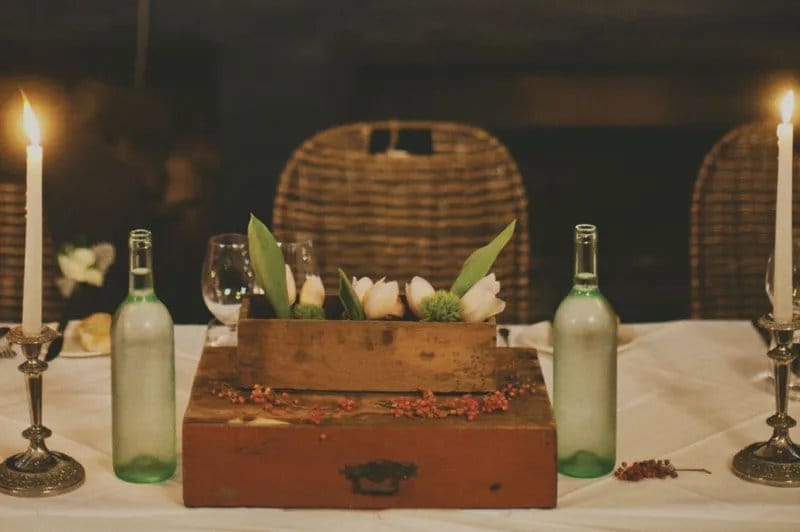 Candlelit table setting with wine bottles and flowers at The Mill Restaurant, Pokolbin
