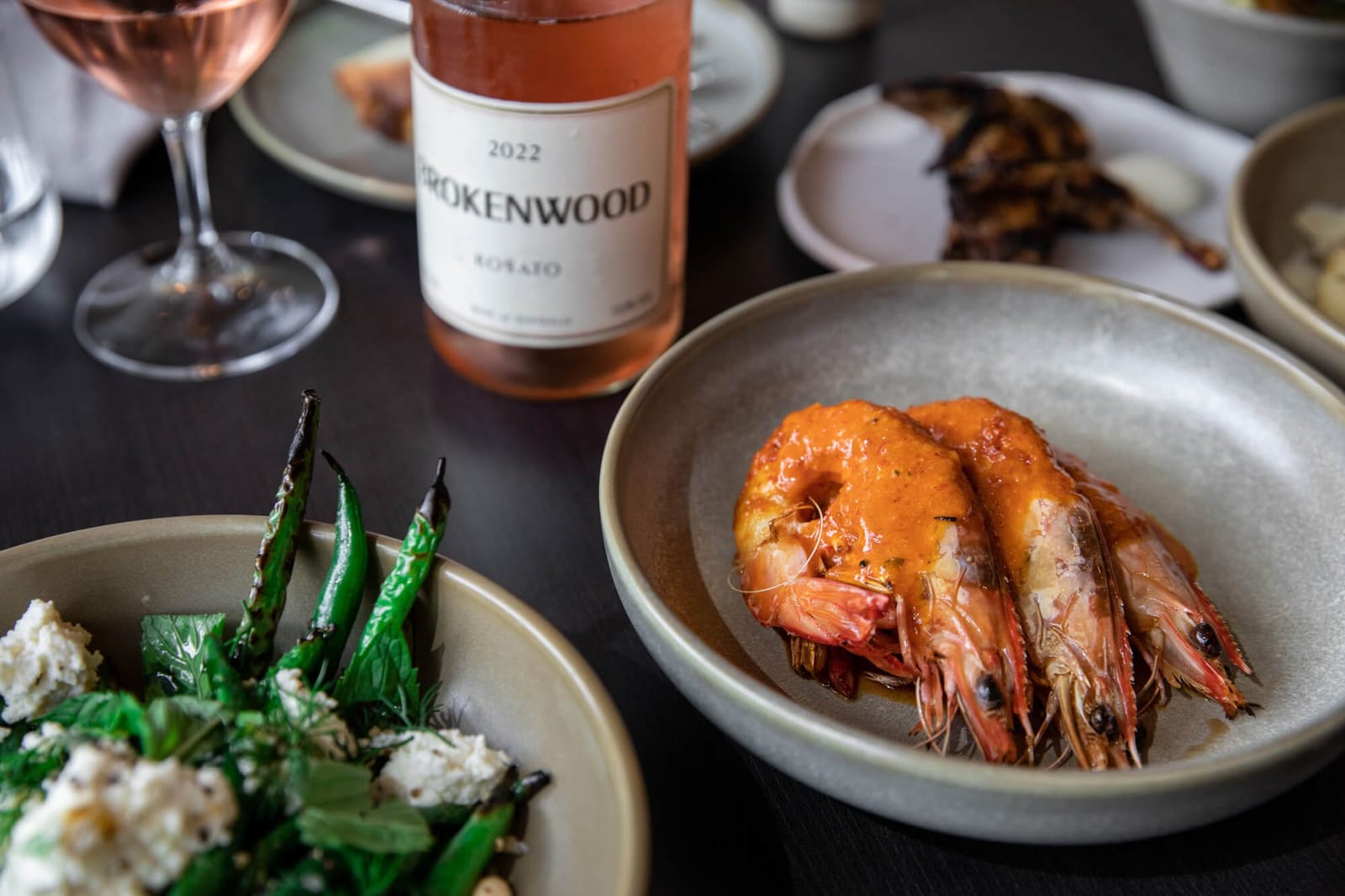 Grilled prawns and a bottle of Brokenwood Rosato at The Wood Restaurant