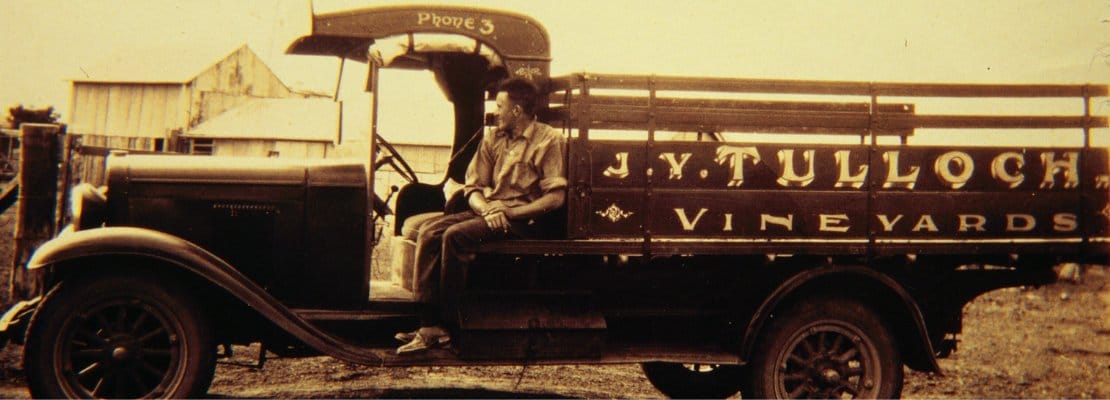 Vintage sepia photograph of historic truck painted with Tulloch Vineyards