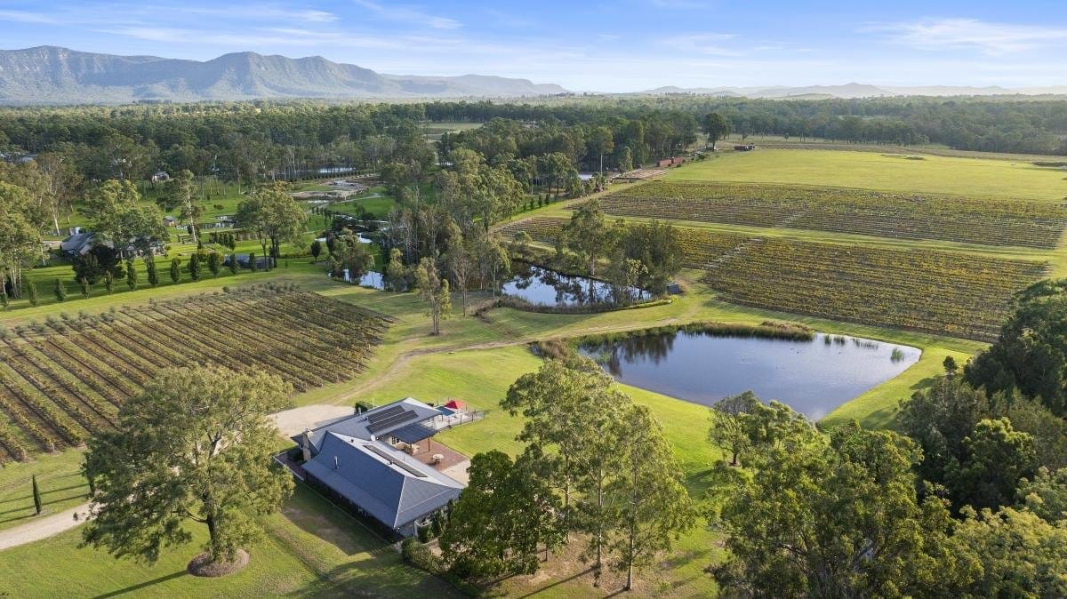 Aerial view of the lodge property surrounded by vineyards and countryside