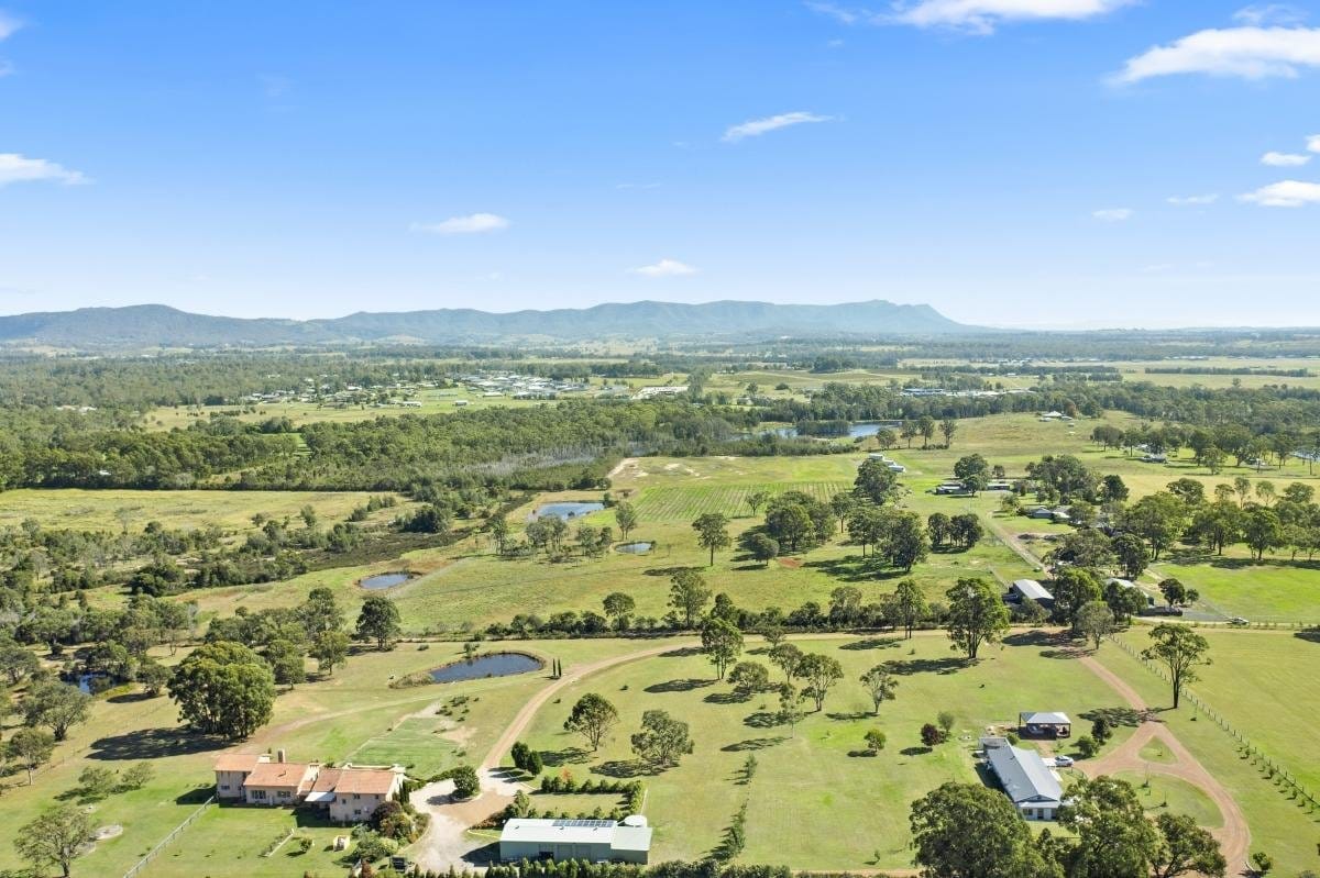 Aerial view of Italian-inspired villa with terracotta roof and vine-covered terrace at Villa Leone, Nulkaba, Hunter Valley