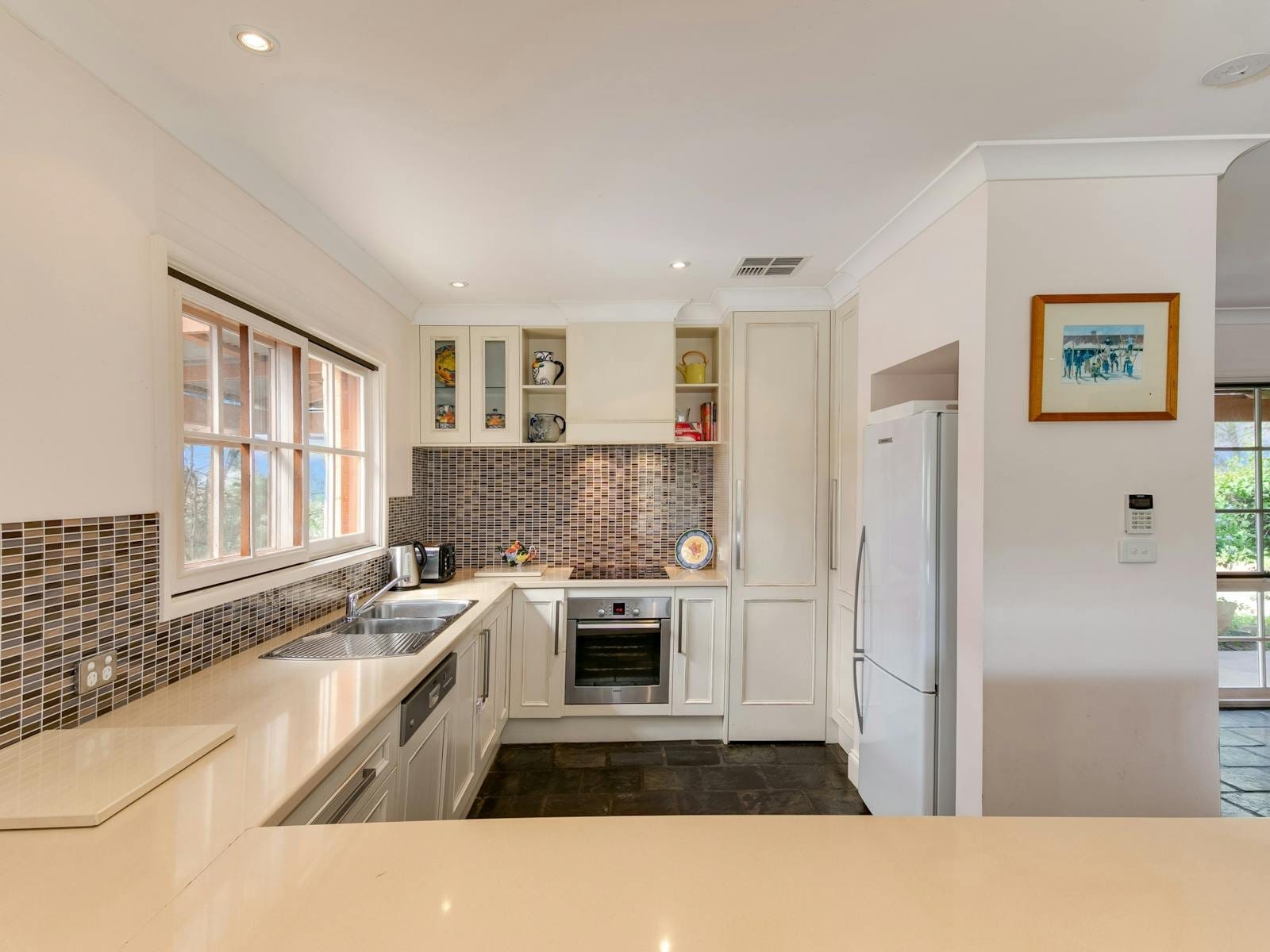 The homestead kitchen, with an oven, dishwasher and breakfast bar