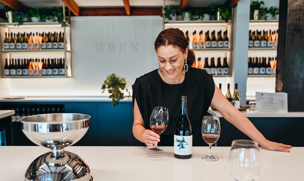 A staff member pouring rose at the Wild Ren tasting bar