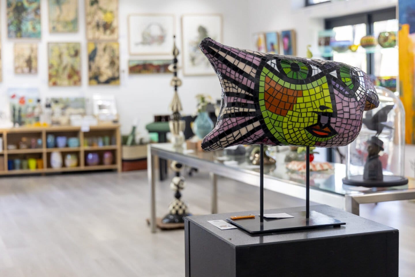 Colourful abstract textile sculpture displayed in art gallery space