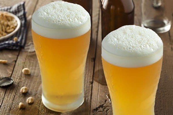 Beers served in pint glasses with foam heads at Wollombi Tavern, Wollombi, Hunter Valley