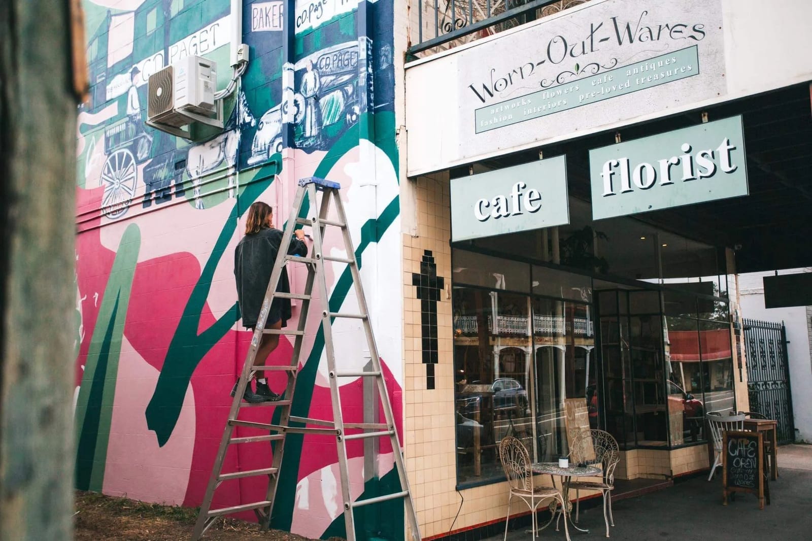 The cafe and florist shopfront on George Street with its painted mural