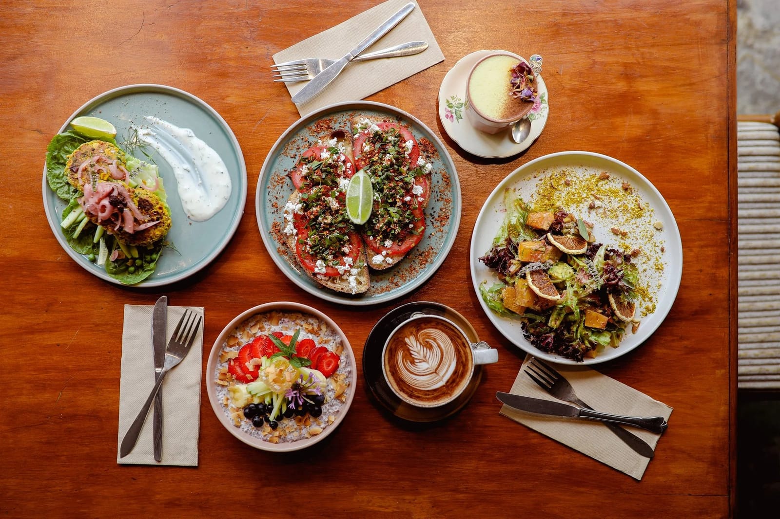 Breakfast plates and coffee photographed from above on timber table at Worn Out Wares Cafe, Singleton, Hunter Valley